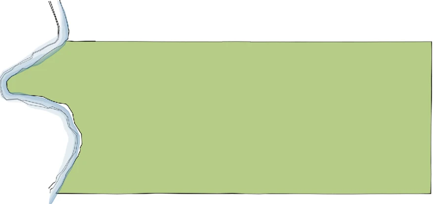 The outline of the lot: a long rectangle whose only irregular edge is the creek to the west, which the project chooses to keep as a floodplain.