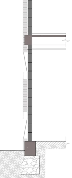 The section through the envelope: an inner wall of structural brick and an outer wall of exposed brick, the pair that stores heat by day and releases it by night.